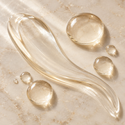 Translucent jelly serum texture on warm stone